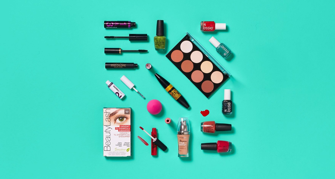Cosmetics placed on a turquoise-green background